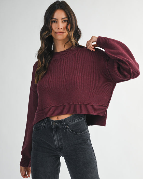 women’s crew neck cropped sweater with side slit detail in wine color