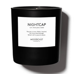 Luxury scented candle with notes of dark rum, black plum, tonka, bergamot, and orange blossom