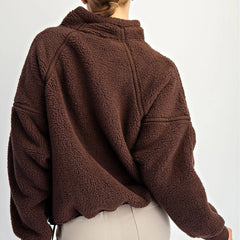 Cozy fleece pullover with adjustable hem and dropped shoulders. Women’s sherpa quarter zip for soft layering and effortless everyday wear.