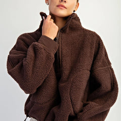 Women’s fleece quarter zip with plush sherpa softness, relaxed fit, and cinchable hem. Cozy, breathable, and perfect for everyday layering.