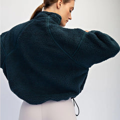 Sherpa quarter zip pullover with mock neck and side pockets. Lightweight fleece comfort for coffee runs, travel days, and chilly mornings.