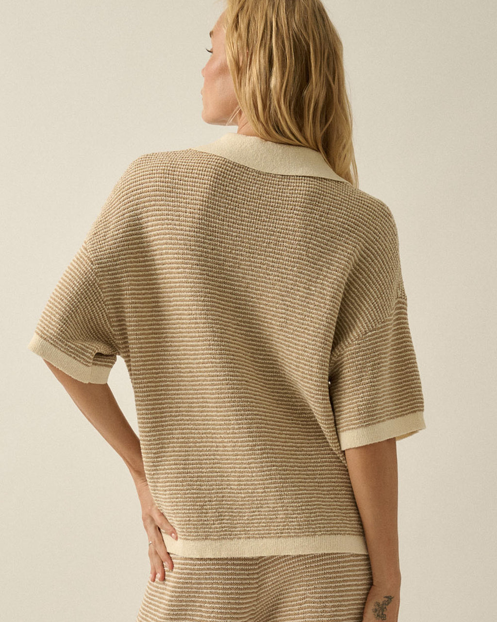 Relaxed fit striped knit top styled casually