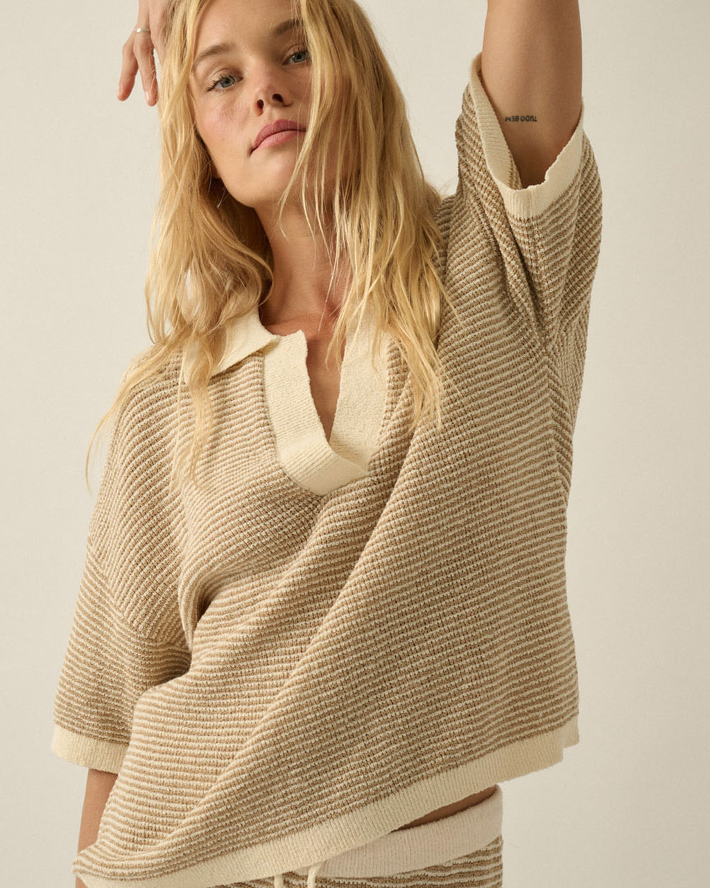 Women’s striped rib knit top with contrast trim and short sleeves