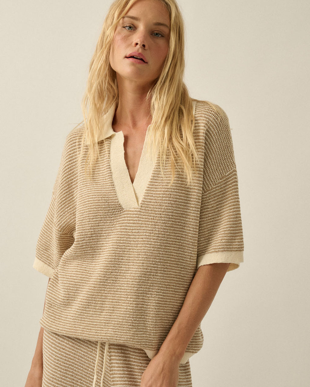 Cream and sand striped rib knit collared top with split V neckline