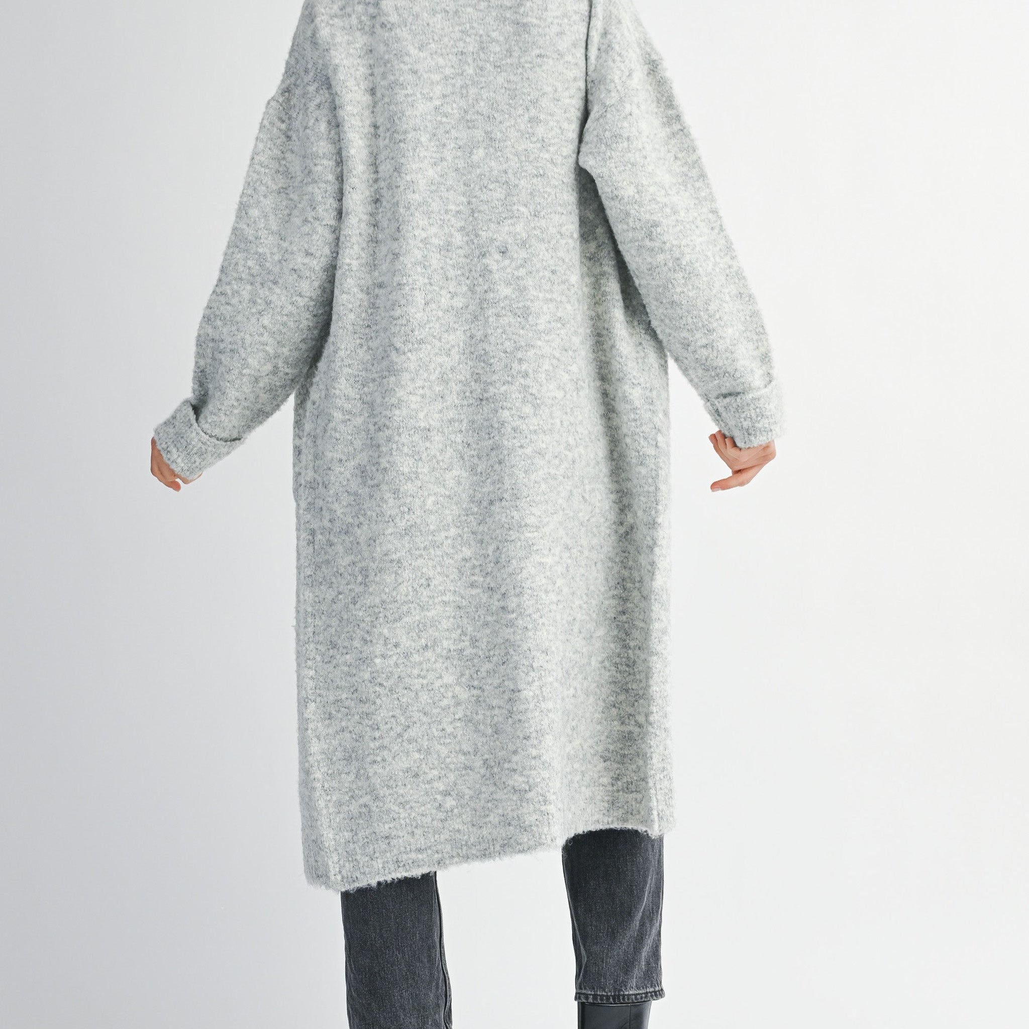 woman wearing long grey cardigan sweater with collared neckline