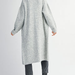 woman wearing long grey cardigan sweater with collared neckline