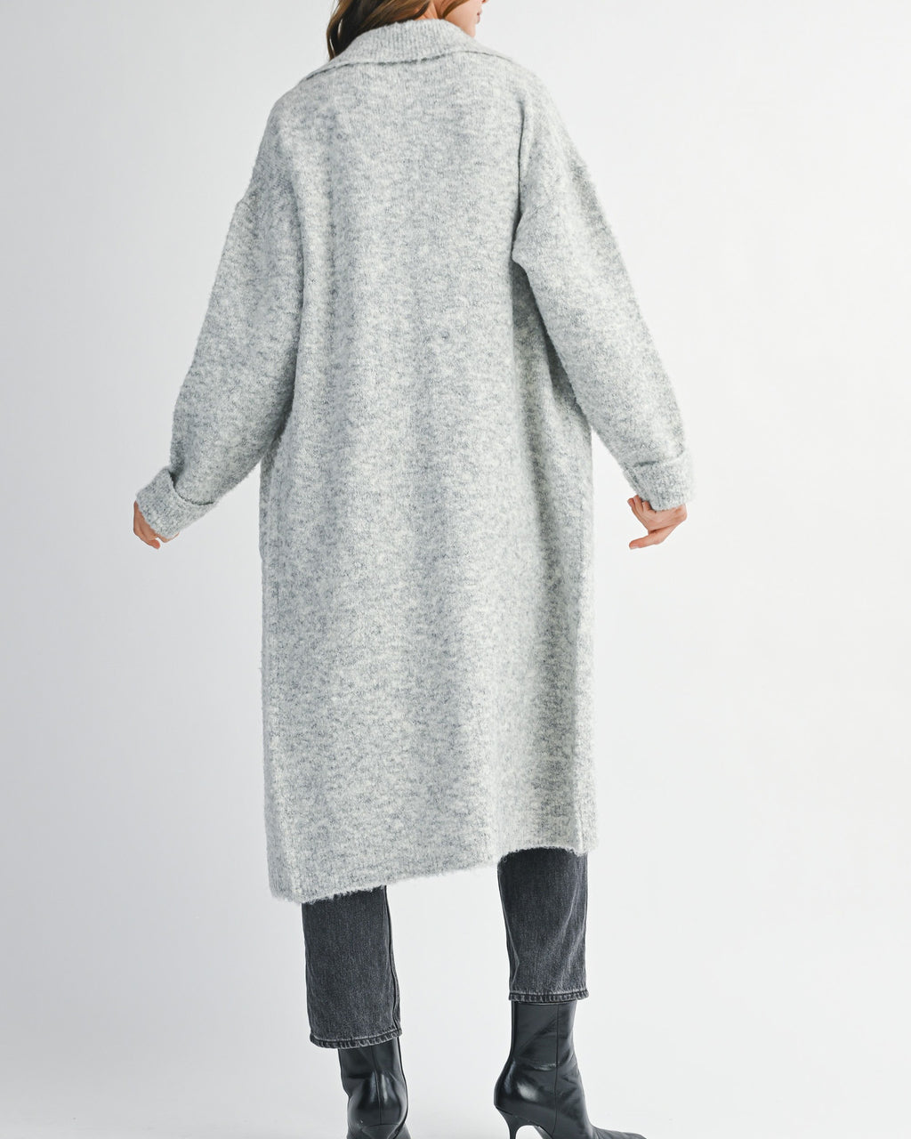 woman wearing long grey cardigan sweater with collared neckline