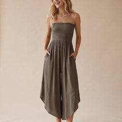 Blue smocked strapless wide-leg jumpsuit with pockets and flowy round hem detail