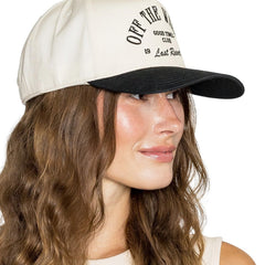 Cream and black trucker hat with “Off The Wagon” embroidered text
