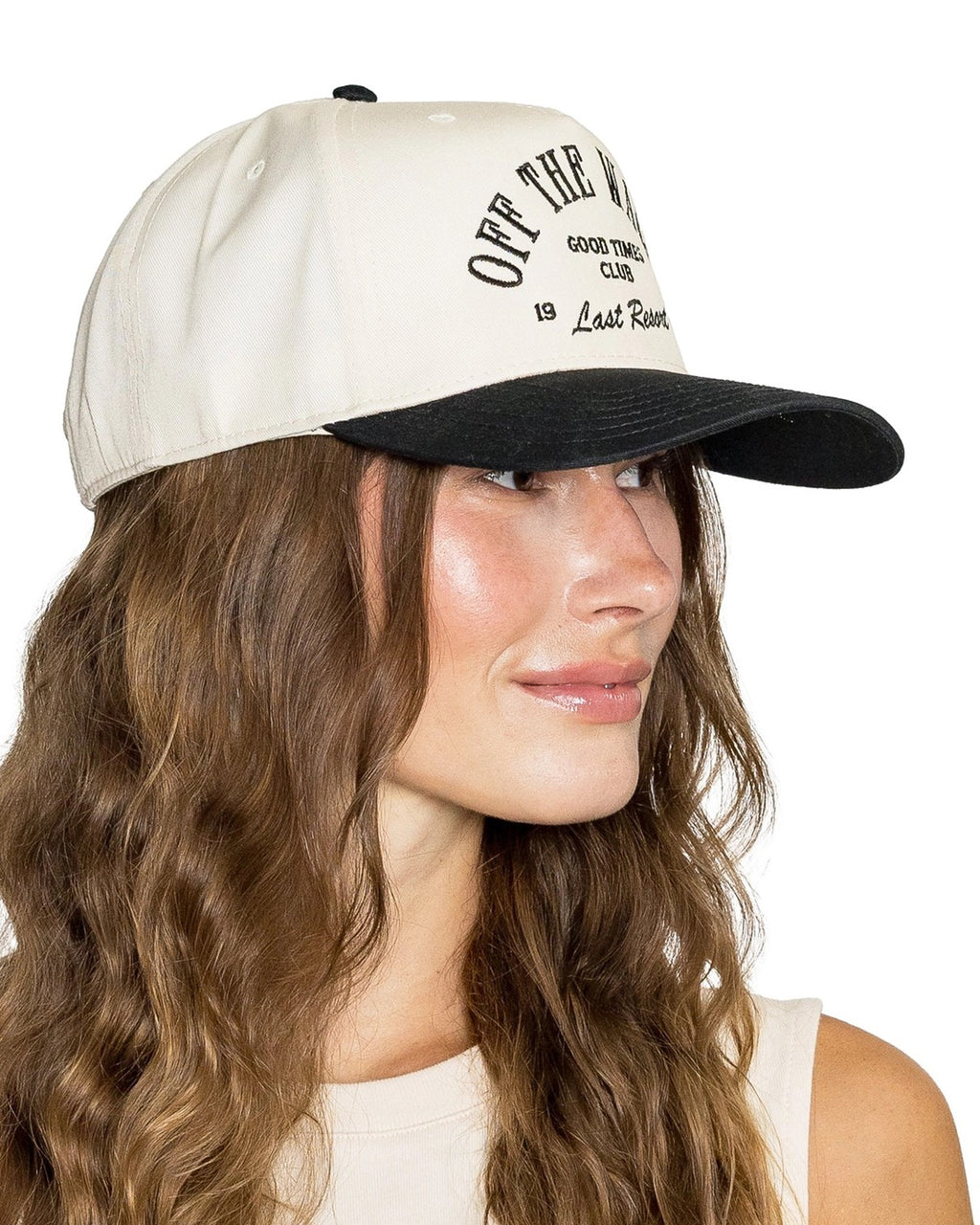 Cream and black trucker hat with “Off The Wagon” embroidered text
